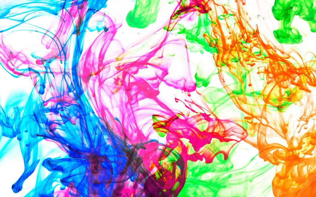 Vibrant ink-in-water abstract wallpaper with swirling magenta blue green and orange fluid art