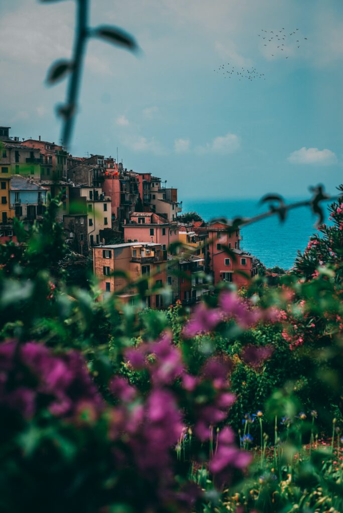 Vibrant Italian Coastal City Wallpaper with Colorful Buildings & Sea