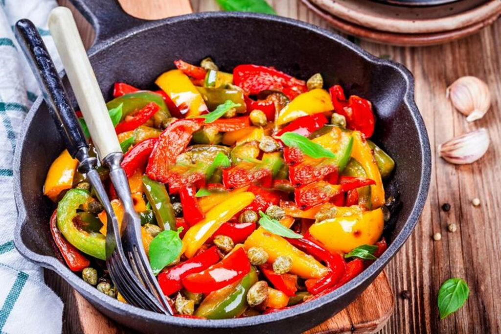Vibrant Italian Lecho Wallpaper: Colorful Skillet Dish on Wood Table