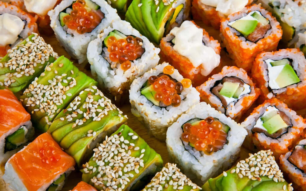 Vibrant Japanese Sushi Rolls with Colorful Toppings - Wallpaper Background