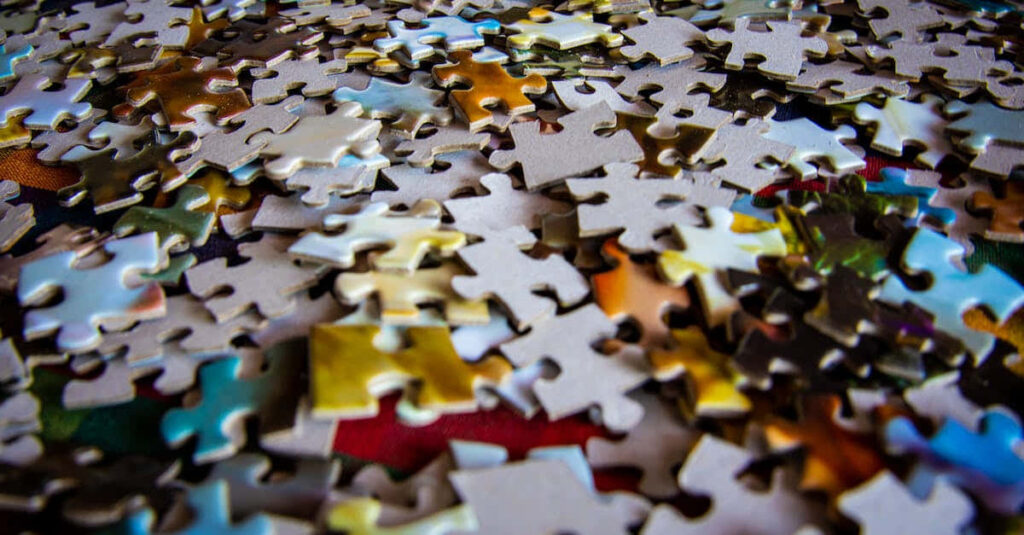 Colorful Jigsaw Puzzle Pieces Close-Up Wallpaper Background