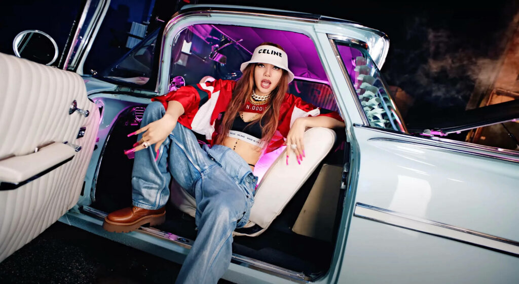 Vibrant K-Pop Idol Lisa Wallpaper: Stylish & Confident In Colorful Car