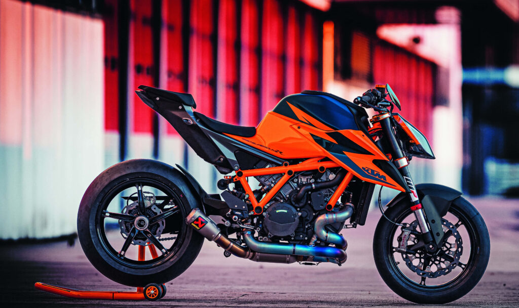Vibrant KTM Bike Wallpaper: Bold Orange & Black Design Background