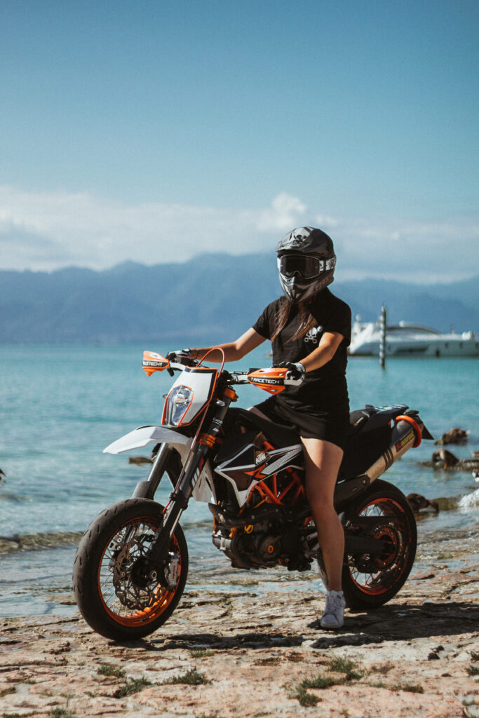 KTM Biker Beach Wallpaper: Adventure Amidst Turquoise Waters