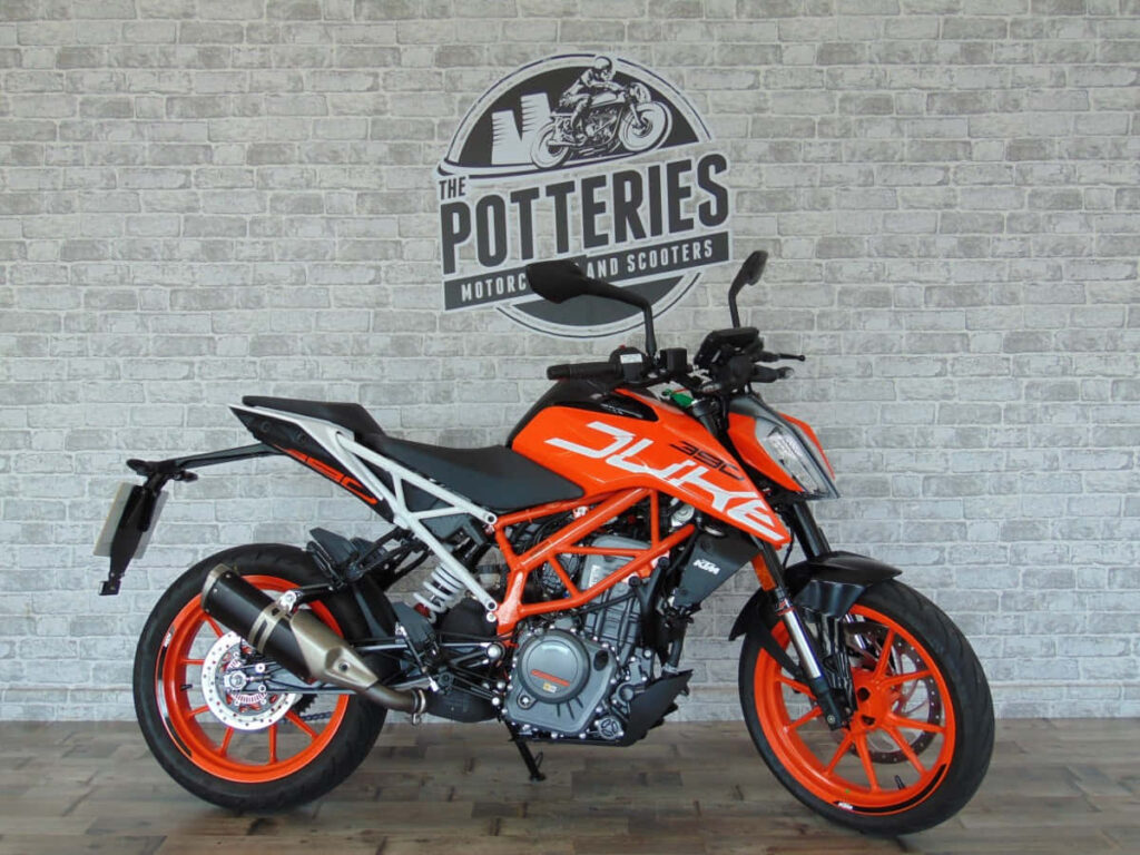 KTM Duke Motorcycle Wallpaper: Sleek Orange & Black Adventure Design