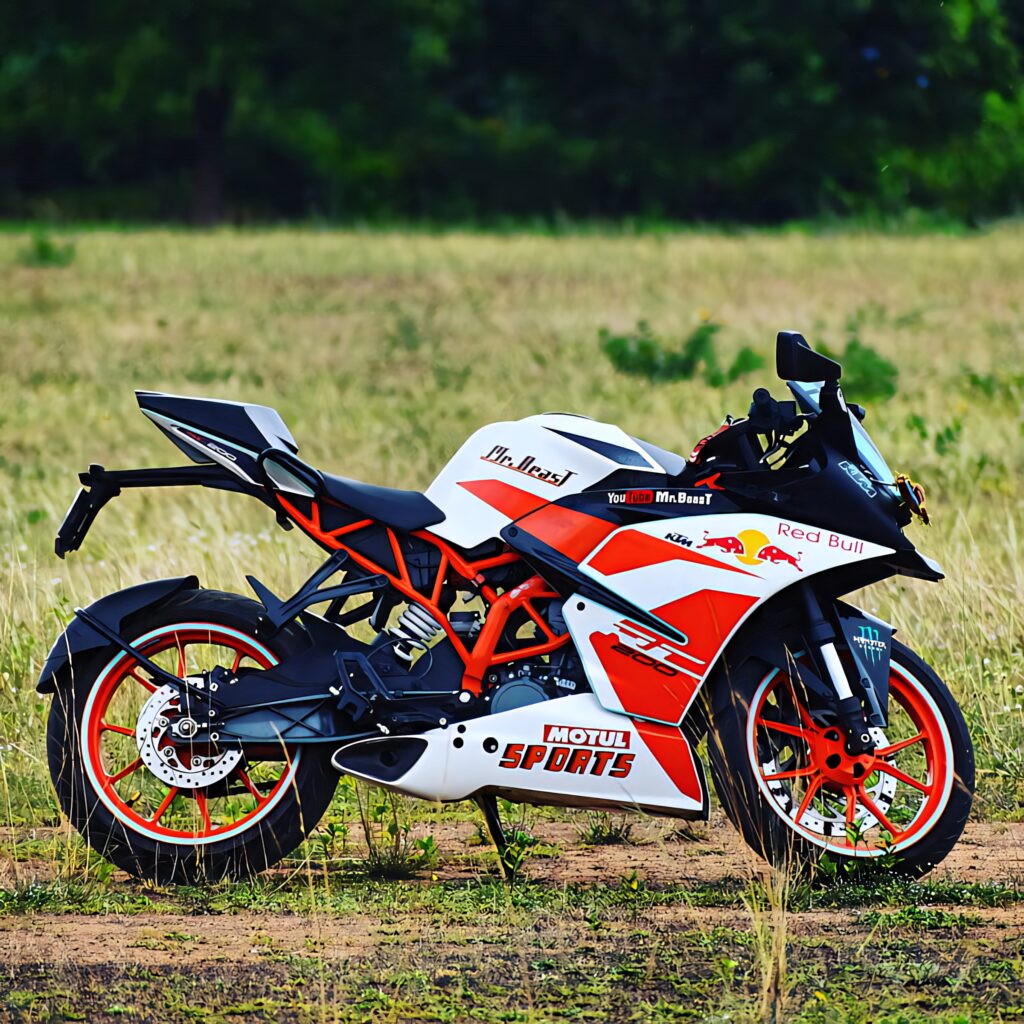 Vibrant KTM RC 200 Wallpaper: Sporty Design & Scenic Backdrop