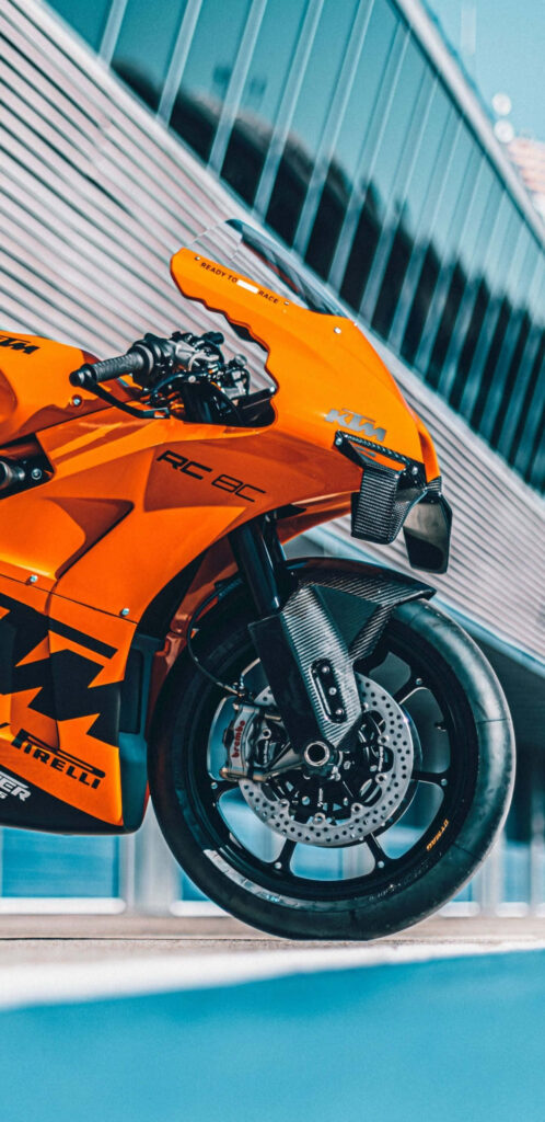 KTM RC 8C Motorcycle Wallpaper: Vibrant Design on Racing Track