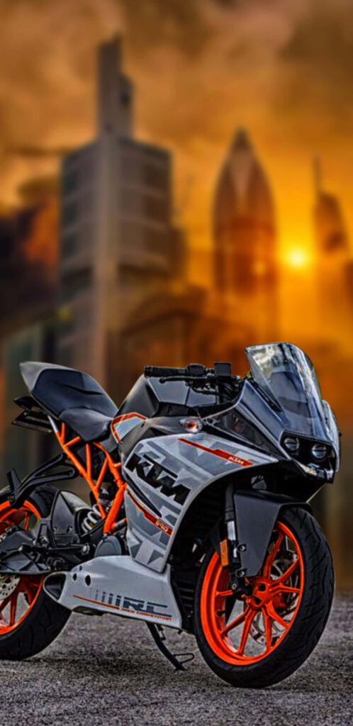 Vibrant KTM Sports Bike Wallpaper: Urban Sunset Adventure Background
