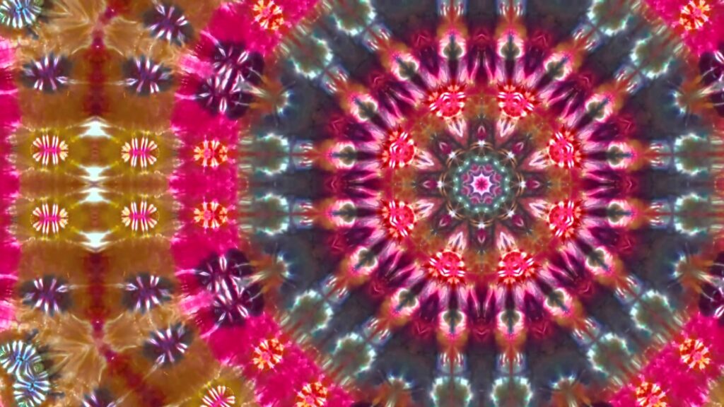 Vibrant kaleidoscopic tie-dye wallpaper with pink blue gold and white psychedelic symmetrical pattern