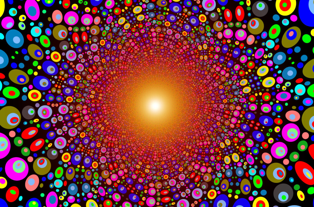 Vibrant Kaleidoscopic Wallpaper: Colorful Circles Explosion Background