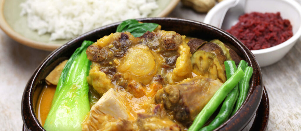 Vibrant Kare-Kare Wallpaper: Filipino Stew & Rice Background