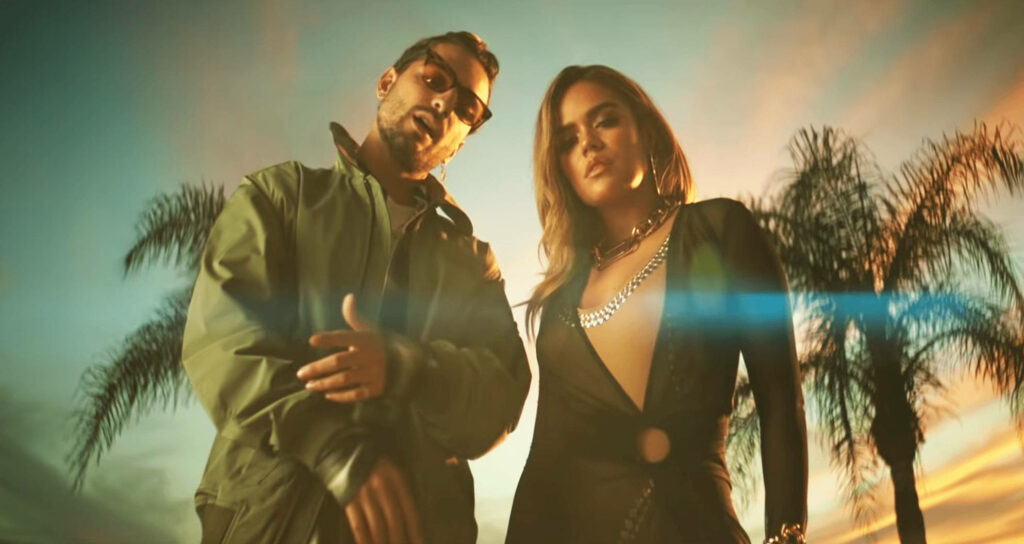 Vibrant Karol G & Anuel AA Wallpaper: Sunset & Palm Trees Background