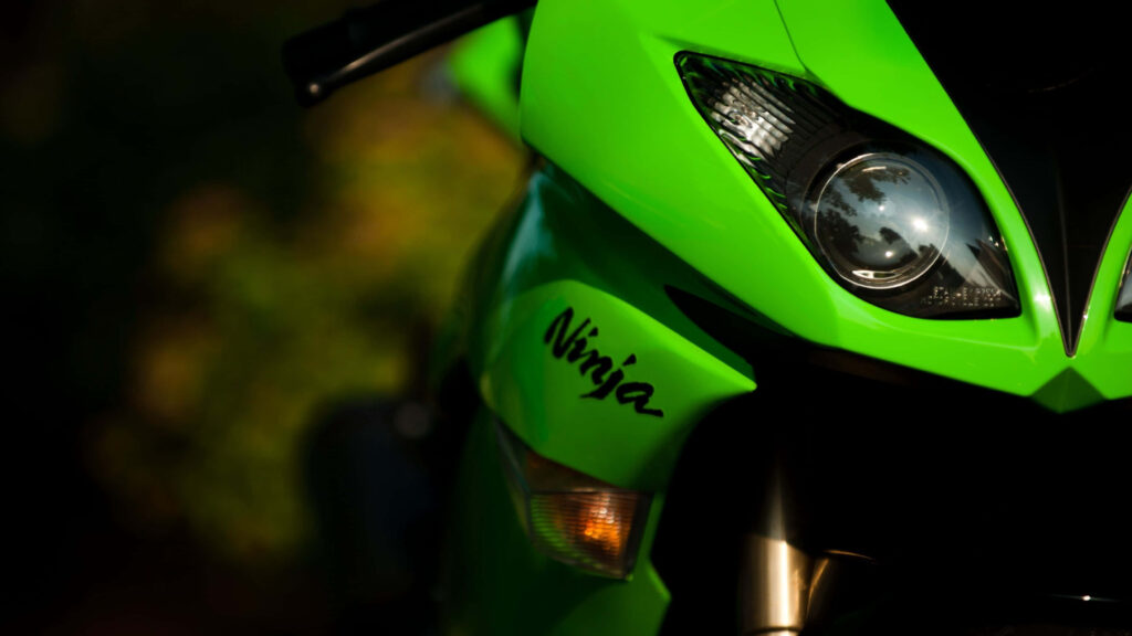 Vibrant Green Kawasaki Ninja Close-Up Wallpaper for Motorcycle Lovers