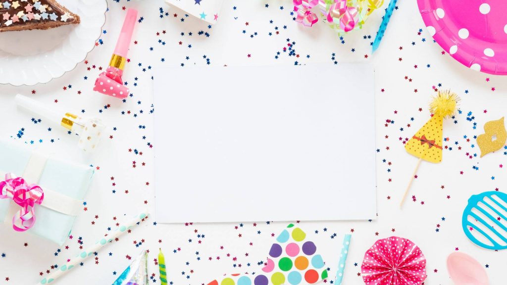 Bright party wallpaper with hats horns star confetti and blank space for text celebration decor