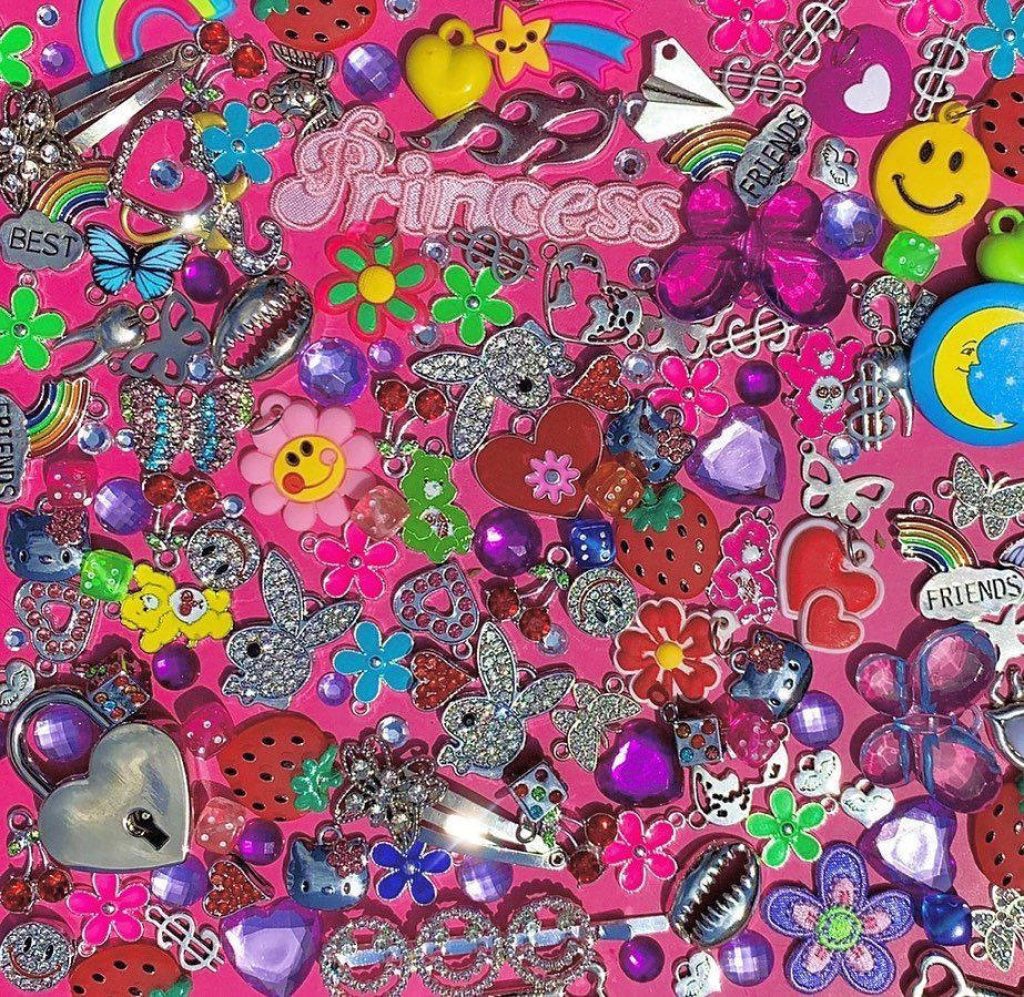 Vibrant Kidcore Y2K wallpaper with colorful charms beads hearts flowers butterflies and Hello Kitty