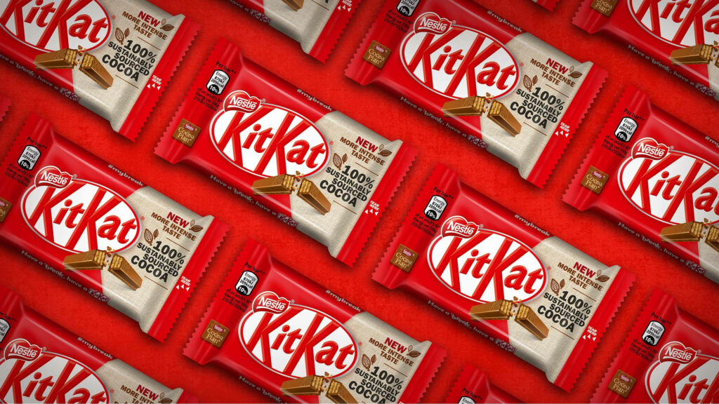 Vibrant Kit Kat Wallpaper: Red-Wrapped Bars in Seamless Pattern
