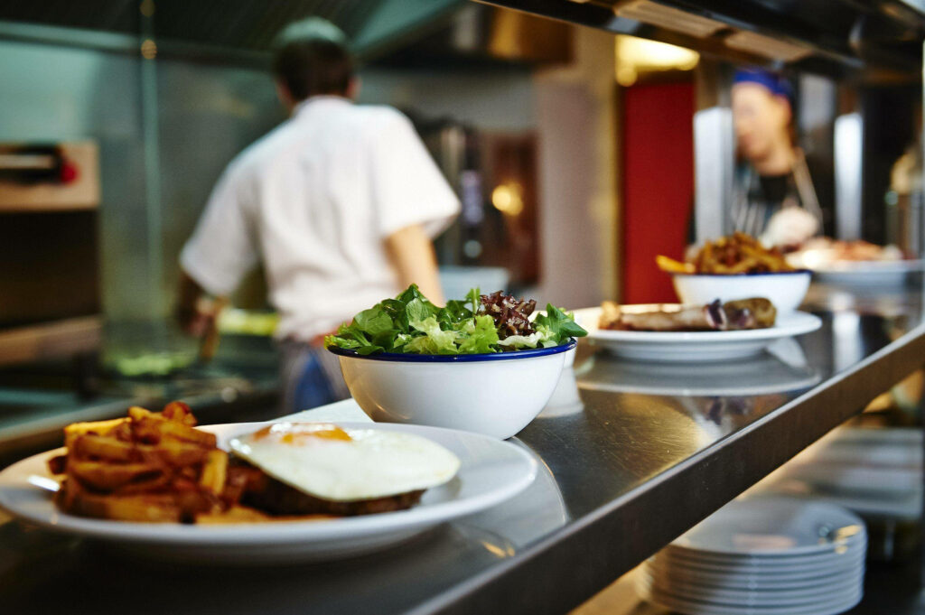 Vibrant Restaurant Kitchen Wallpaper: Fresh Dishes & Chefs At Work