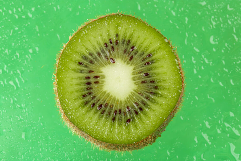 Vibrant Kiwi Slice Macro: Intricate Details & Textures Wallpaper