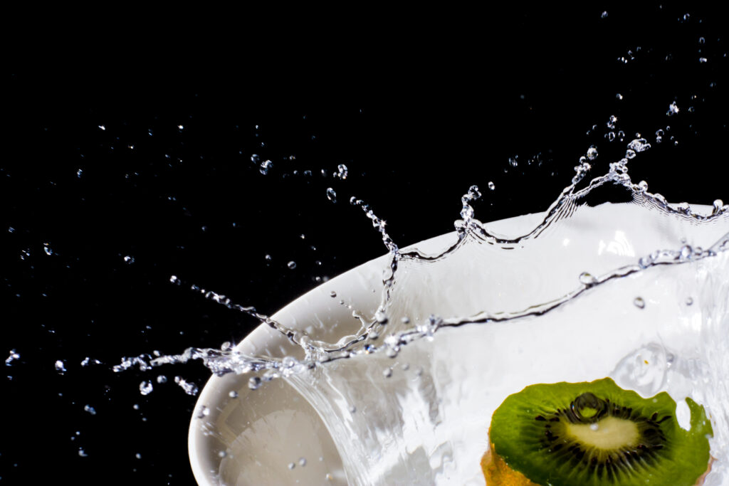 Juicy Kiwi Slice Splash: Vibrant Macro Wallpaper Background