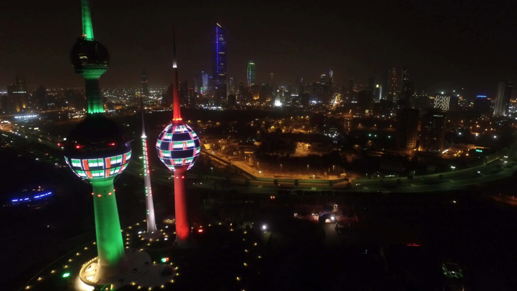 Vibrant Kuwait Towers Nighttime Wallpaper - Colorful Cityscape View