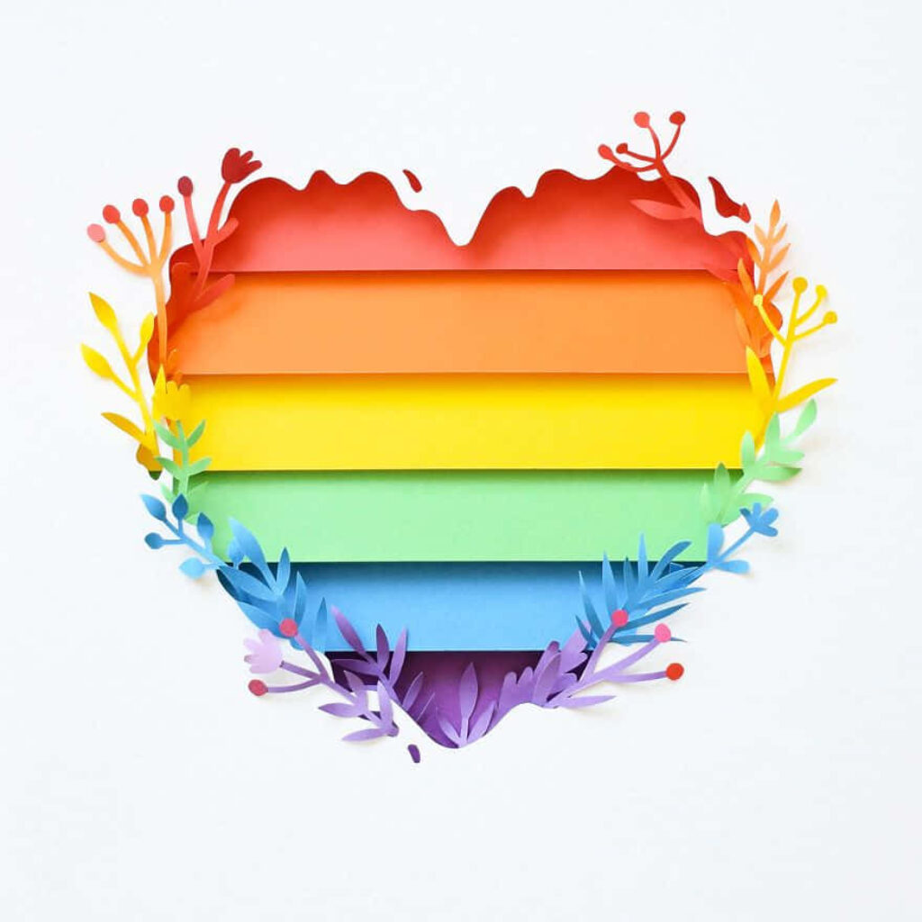 Vibrant LGBT Heart Wallpaper: Colorful Paper Craft with Floral Accents