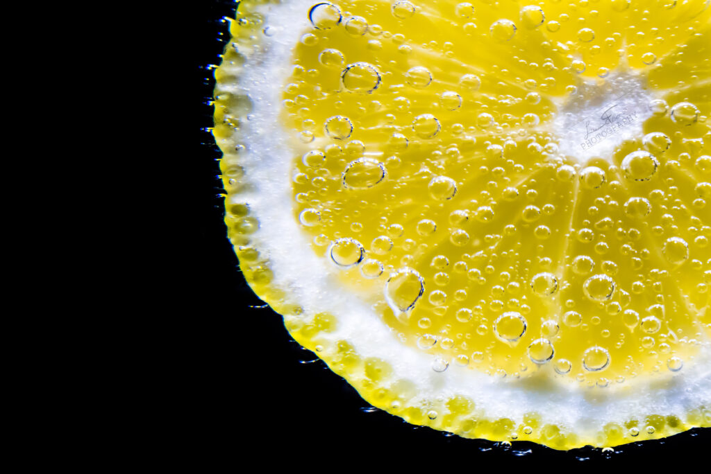 Vibrant Lemon Slice Macro with Bubbles - Citrus Texture Wallpaper