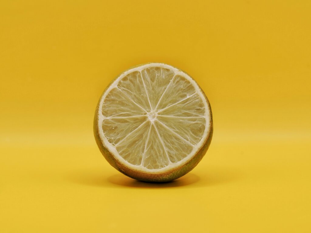 Vibrant Lemon Slice Wallpaper: Bright Yellow Citrus Texture