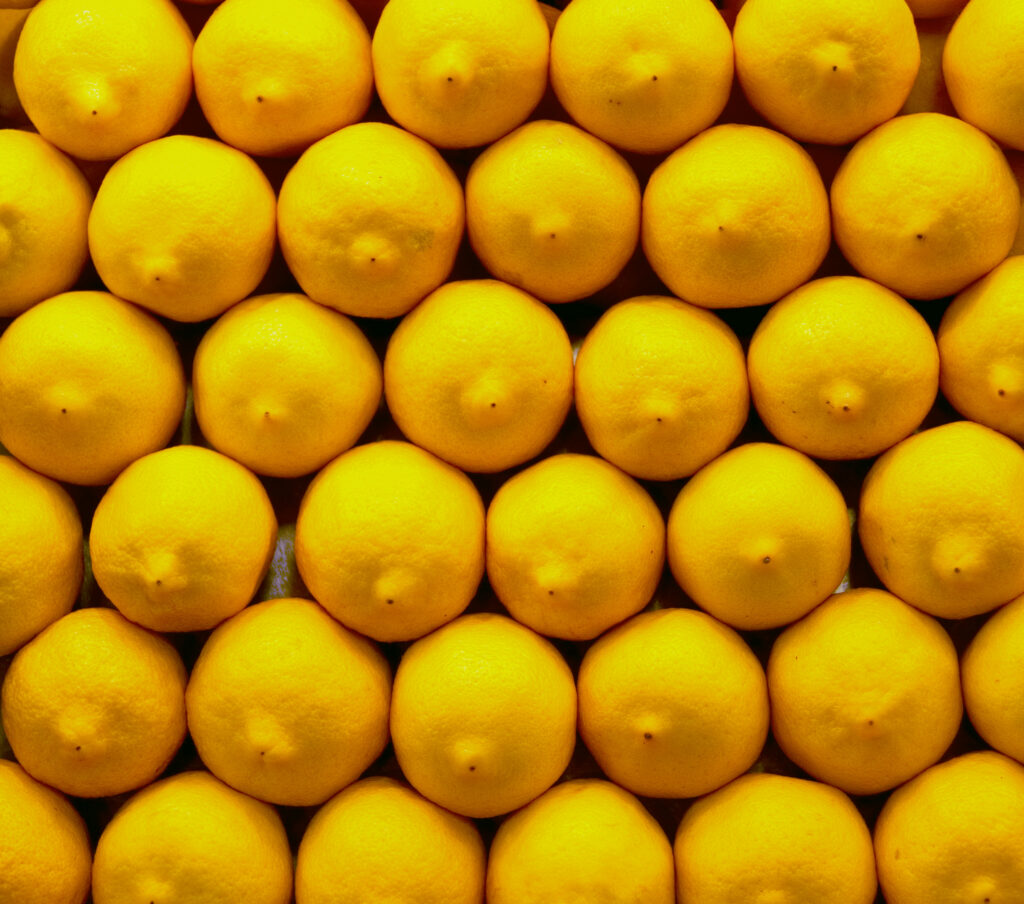 Bright Yellow Lemon Wallpaper: Vibrant Citrus Pattern Background