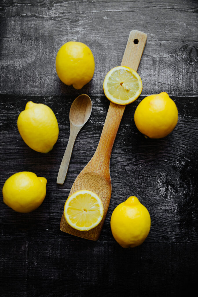 Vibrant Lemon Wallpaper: Fresh Citrus on Dark Textured Surface