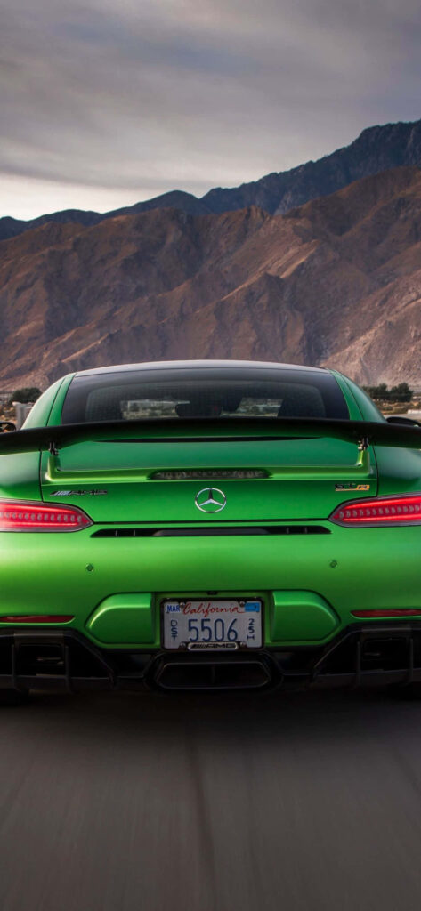 Vibrant light green 2018 Mercedes-Benz AMG GT R rear view with scenic mountain background wallpaper
