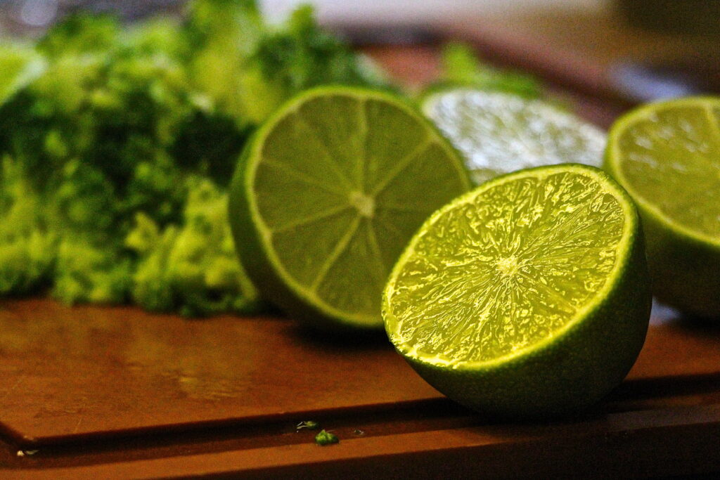 Vibrant Lime Halves: Bright Green Citrus Texture Wallpaper Background