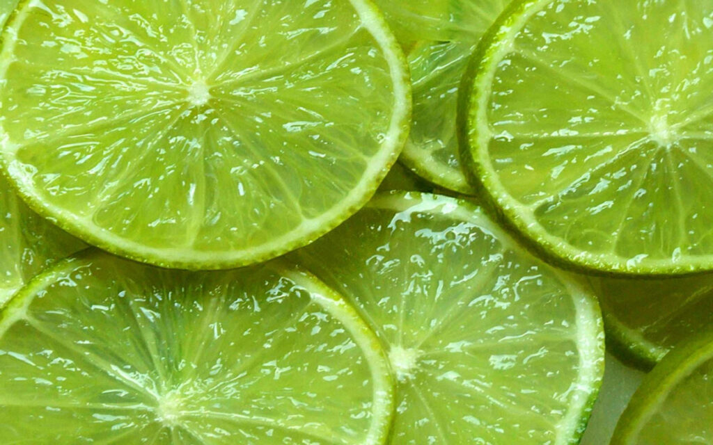 Vibrant Lime Slice Wallpaper: Fresh, Juicy Green Background