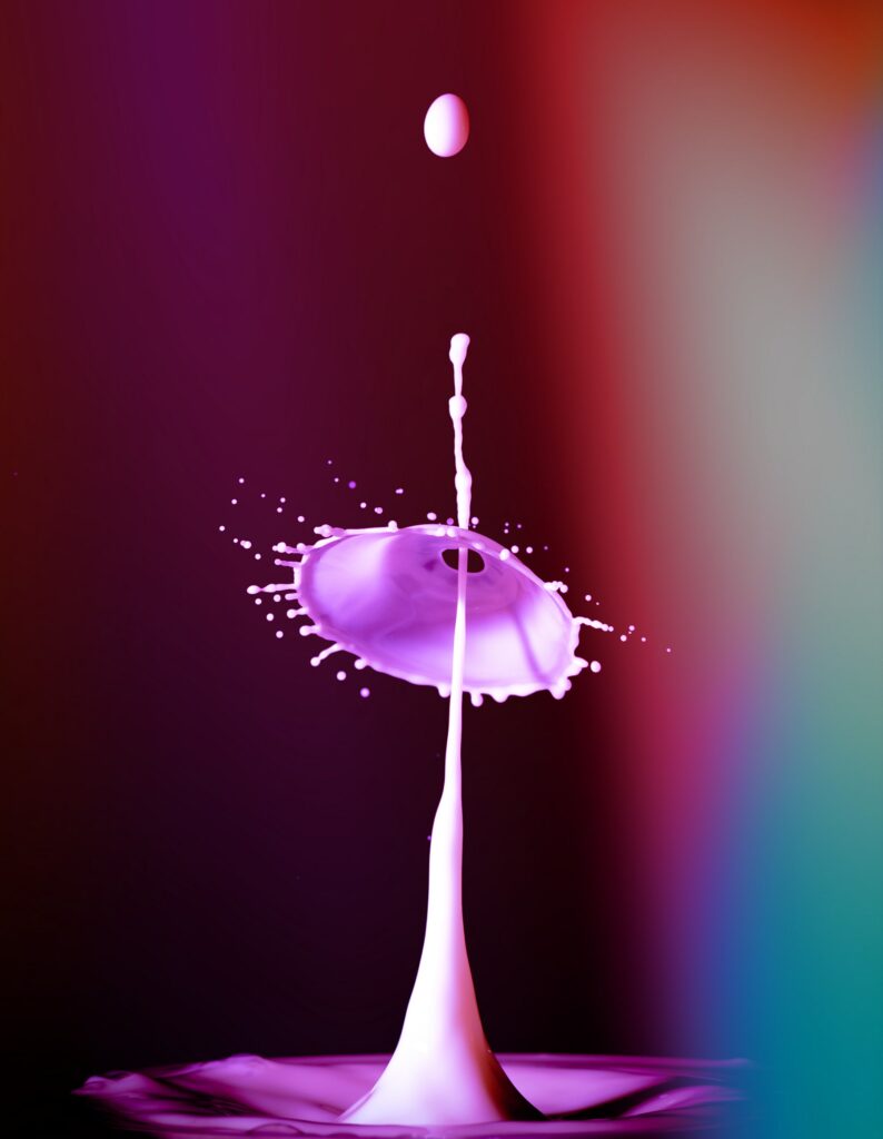 Vibrant Liquid Motion Wallpaper with Purple Drops on Dark Gradient