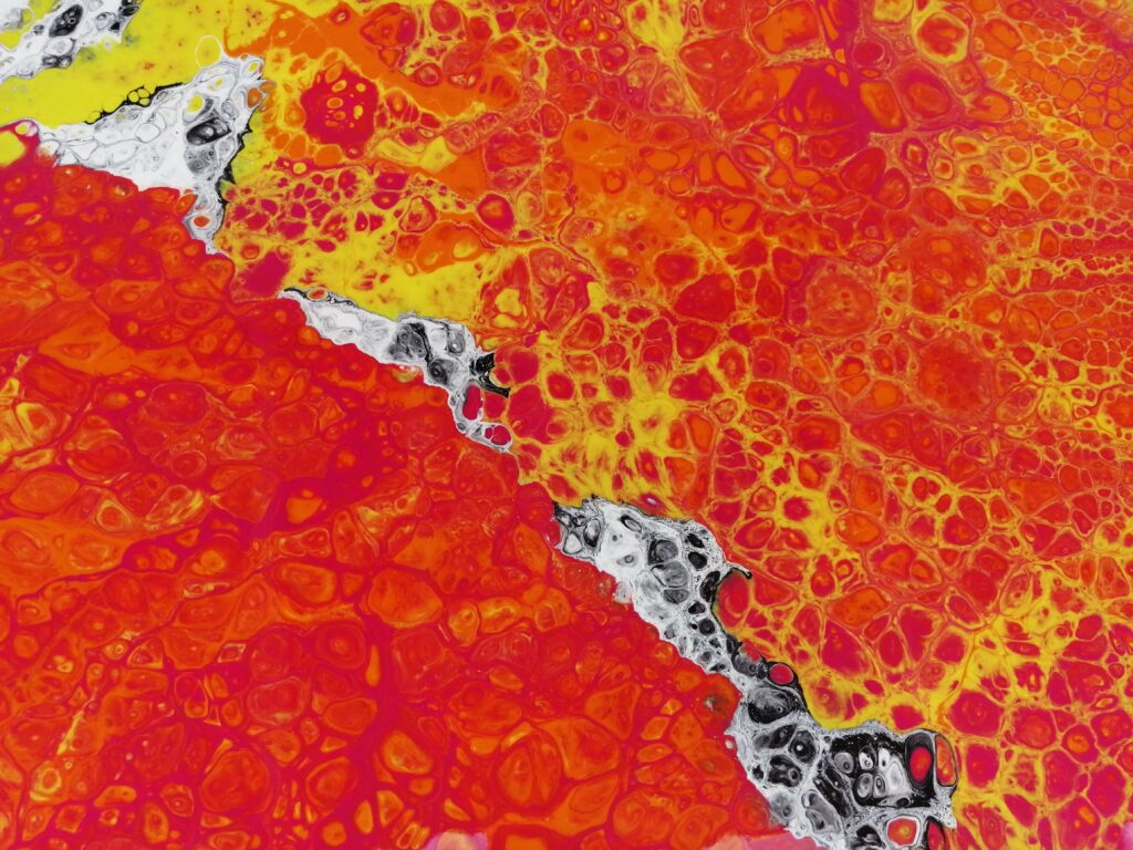 Stunning Macro Liquid Paint Stains: Vibrant Red & Yellow Abstract Background Wallpaper
