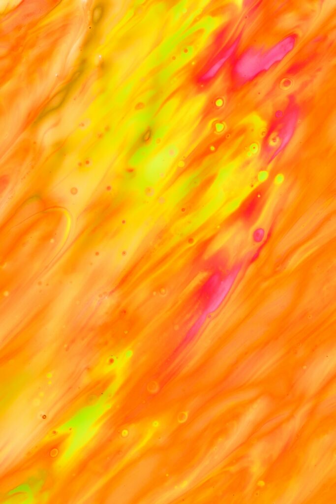 Vibrant Fluid Paint Wallpaper: Dynamic Orange, Yellow & Pink Patterns