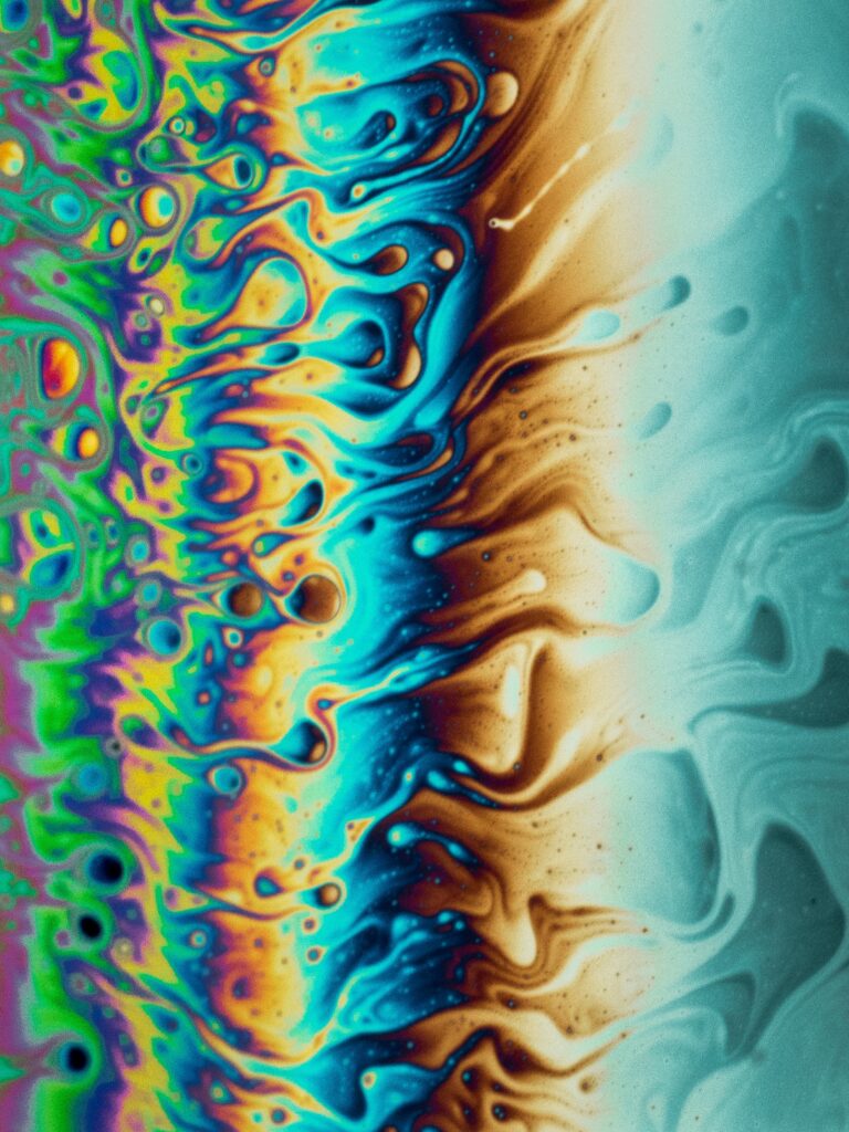 Vibrant Fluid Motion Wallpaper: Colorful Swirling Patterns Background