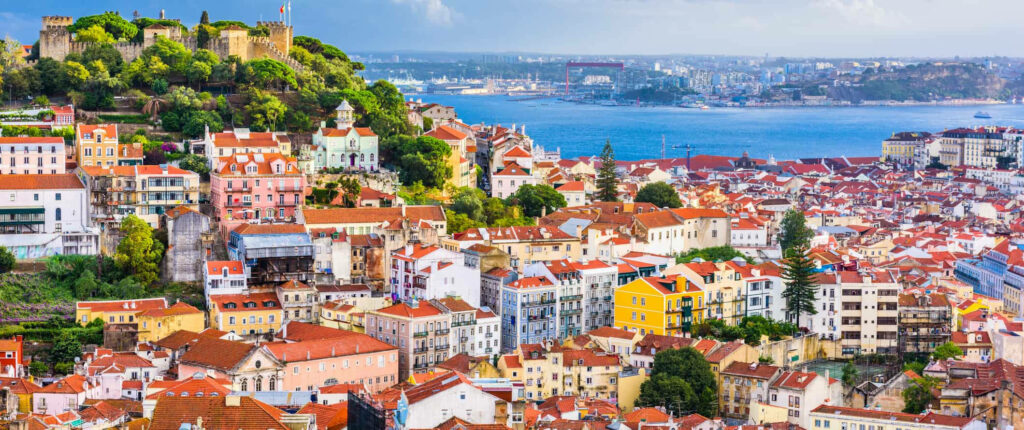 Vibrant Lisbon Wallpaper: Colorful Buildings & Historic Waterfront Scene