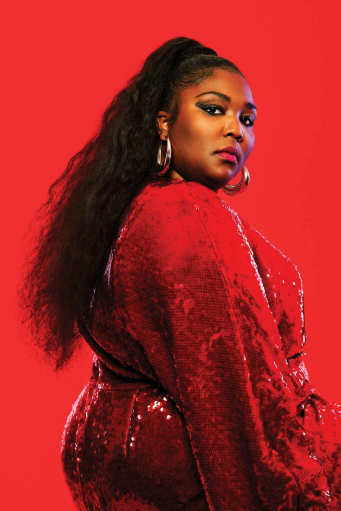 Bold Lizzo Wallpaper: Sequined Red Dress & Vibrant Background