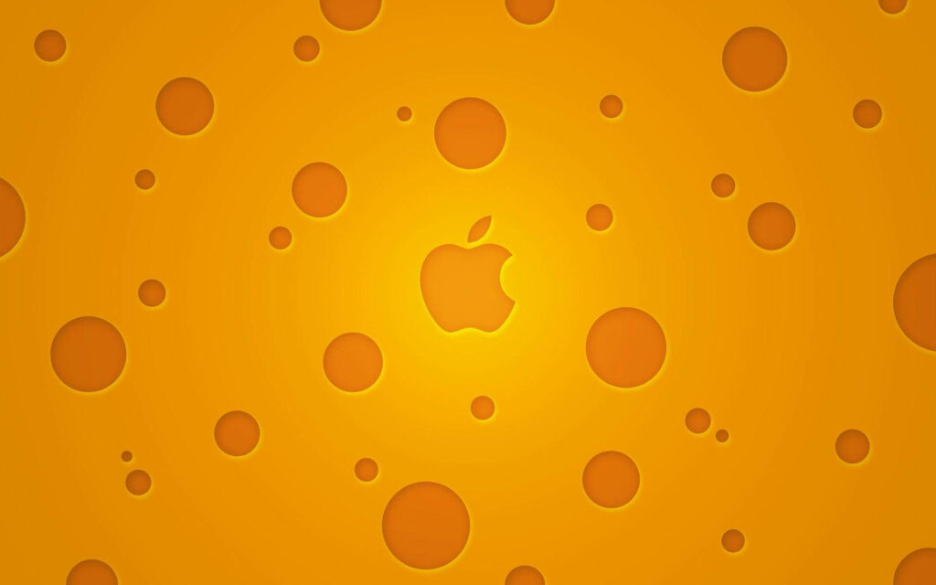 Vibrant Swiss Cheese Background with Iconic Mac Logo Wallpaper
