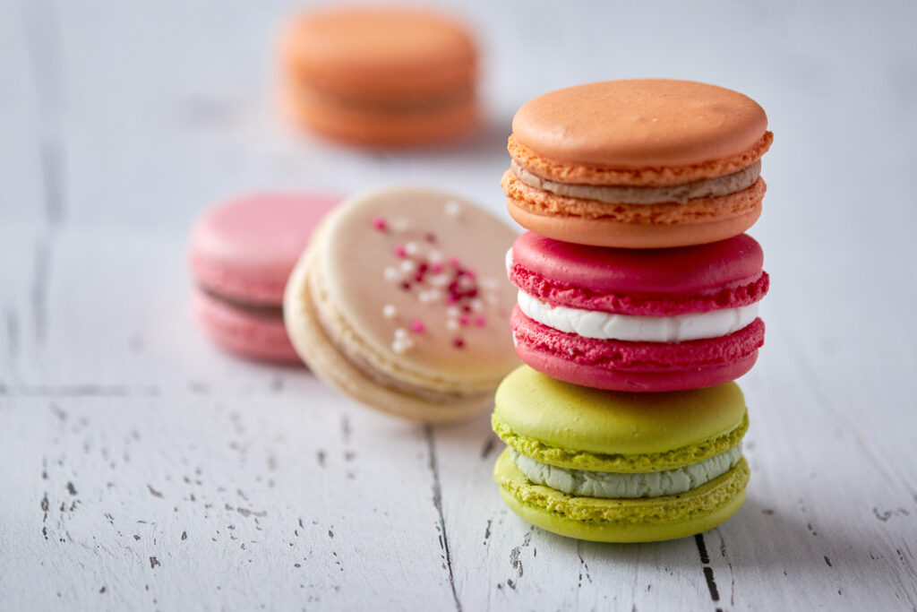 Colorful Macarons on Rustic Wood - Beautiful Wallpaper Background
