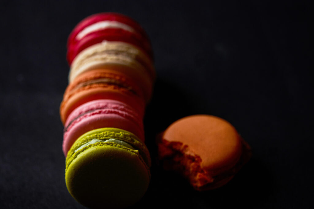 Colorful Macarons & Cookies on Dark Background | Delightful Dessert Wallpaper
