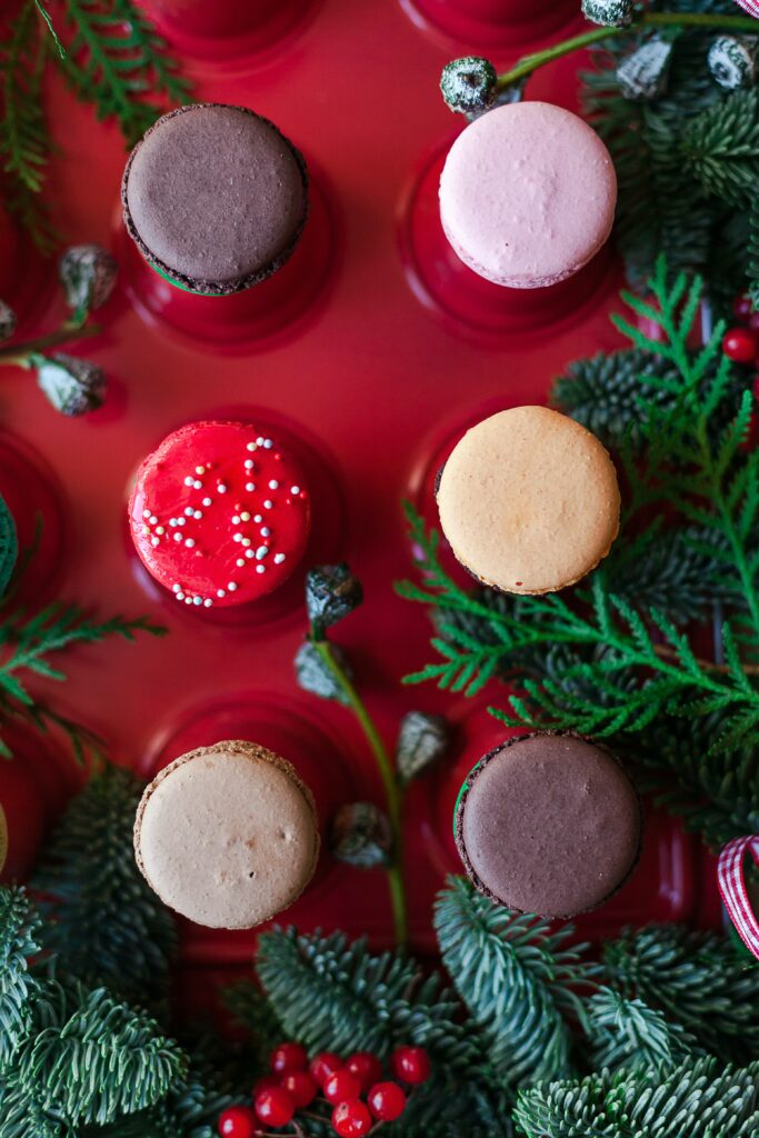 Festive Dessert Wallpaper: Colorful Macarons & Cookies with Greenery
