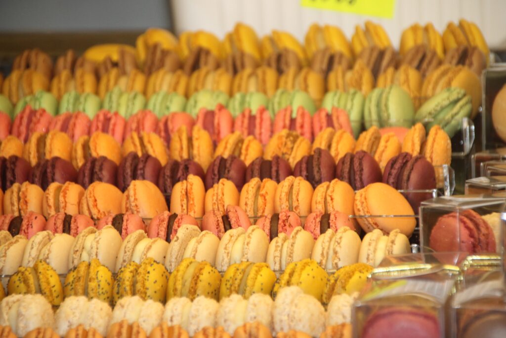 Vibrant Macaron Display: Colorful Assortment in Bakery Wallpaper