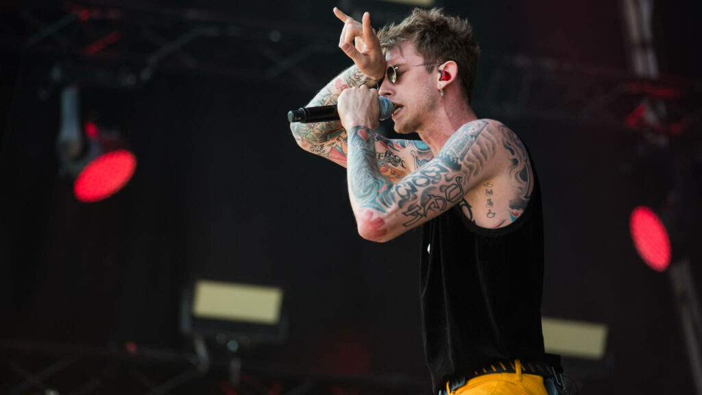 Vibrant Machine Gun Kelly Concert Wallpaper - Energetic Stage Design