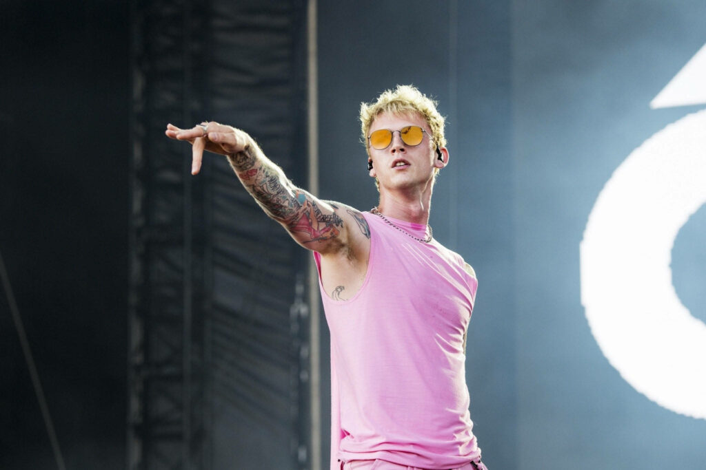Vibrant Machine Gun Kelly Wallpaper: Dynamic Stage Presence