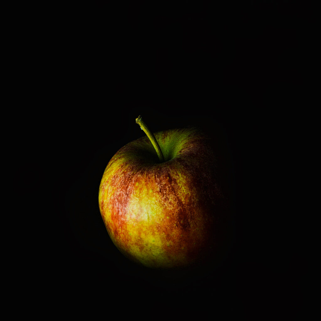 Vivid Macro Apple Wallpaper: Vibrant Colors on Dark Background