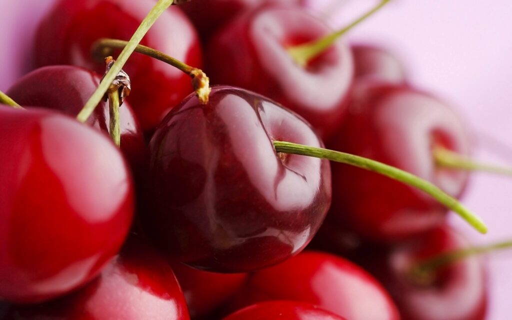Juicy Red Cherries Macro: Glossy Texture Wallpaper Background