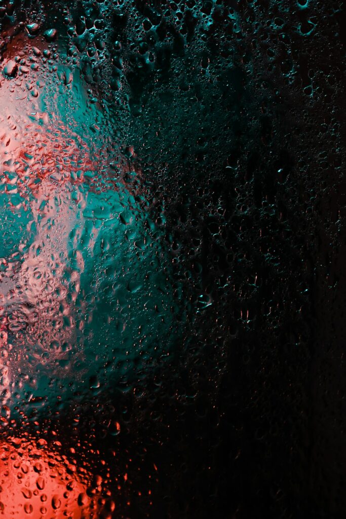 Vibrant Macro Glass Wallpaper: Water Drops & Colorful Light Contrast