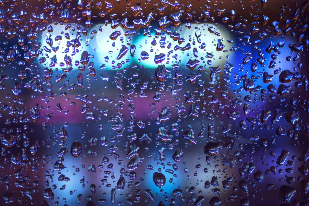 Vibrant Macro Raindrops on Glass with Colorful Bokeh Wallpaper