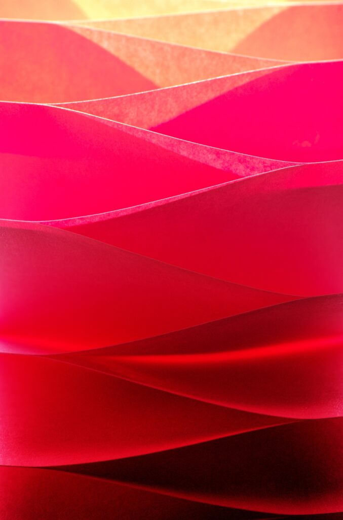 Vibrant Red Paper Layers: Dynamic Textured Wallpaper Background